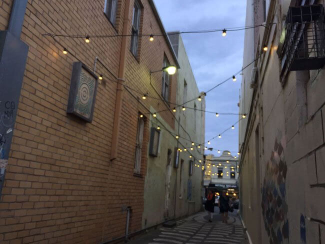 festoon lights hanging in a laneway
