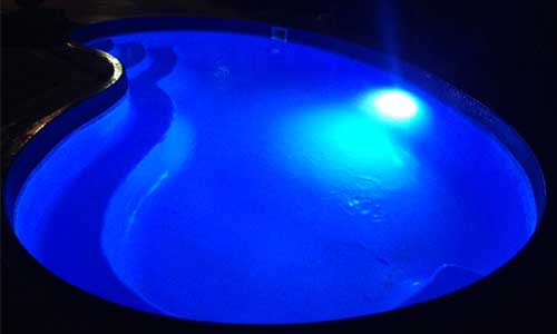 Tear drop shaped pool lit with LED light