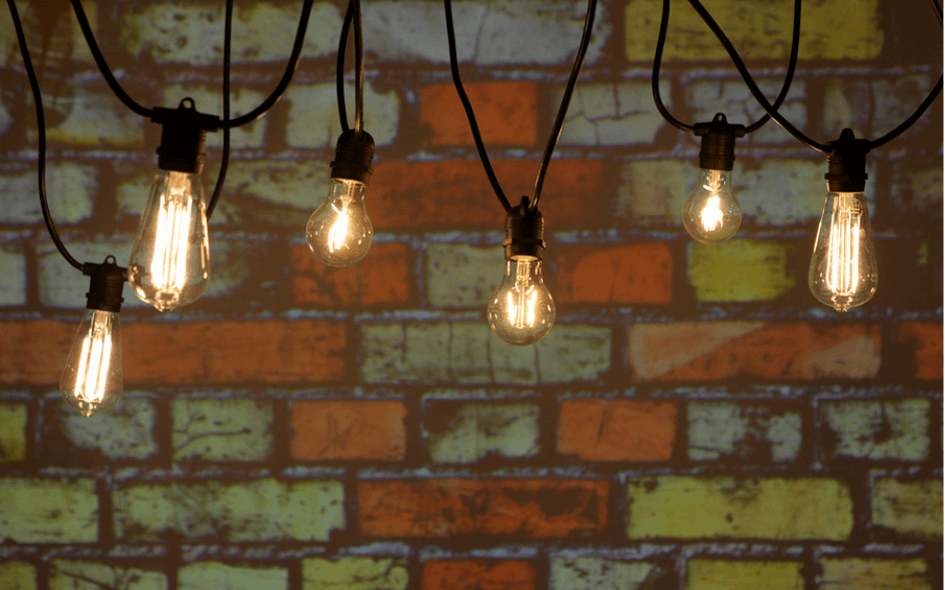 festoon lights in front of the wall