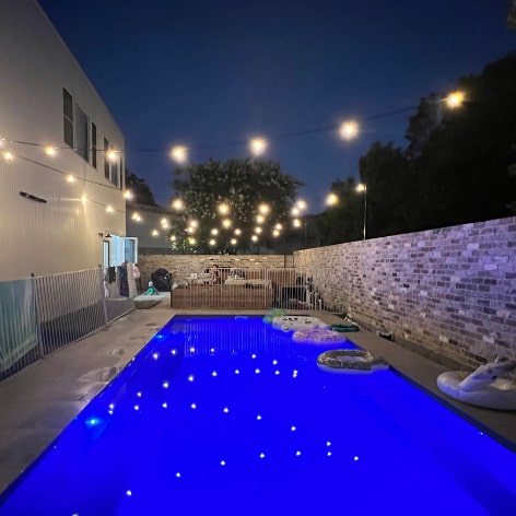 decorated festoon lights over the swimming pool